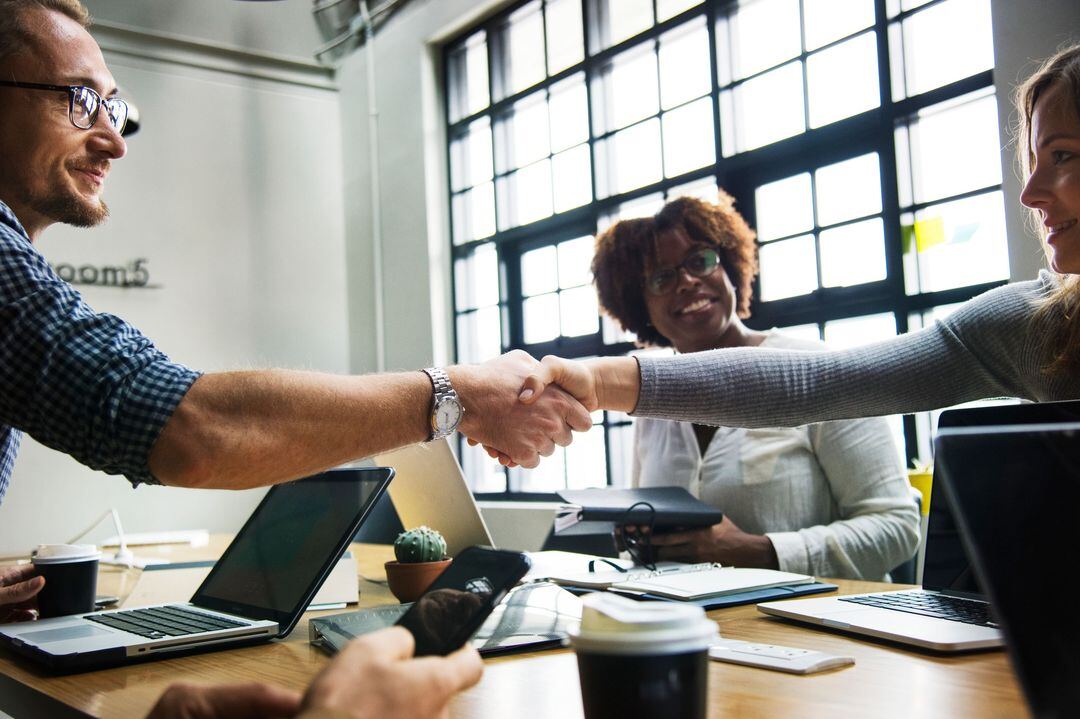 Client shaking hands with a hiring employer